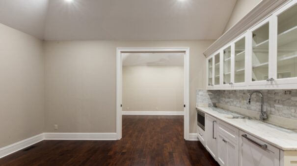 Bella Haven bedroom with kitchenette and hardwood floors