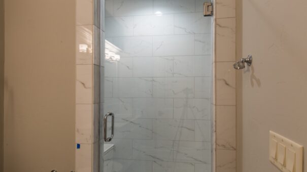 Bella Haven glass shower with marble tile
