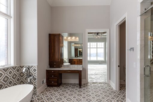 Birchwood primary bath makeup vanity and patterned floor