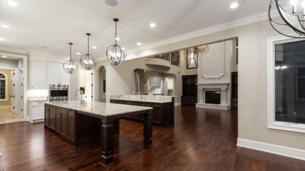 Bella Haven kitchen with dark island and white cabinetry