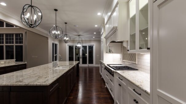 Bella Haven kitchen with white cabinetry and range wall