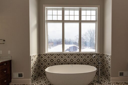 Birchwood primary bath freestanding tub with patterned tile