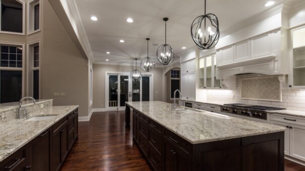 Bella Haven kitchen with granite island and orb chandeliers