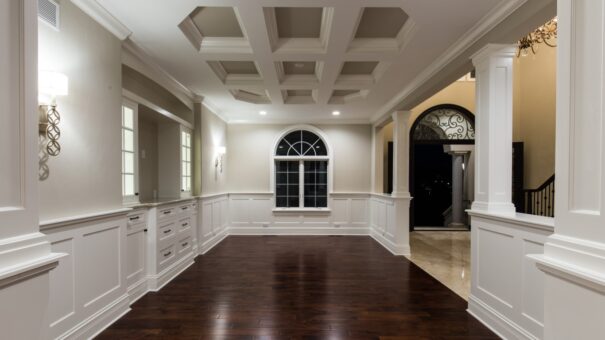 Bella Haven dining room with coffered ceiling and wainscoting