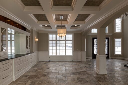 Birchwood dining room with coffered ceiling and window