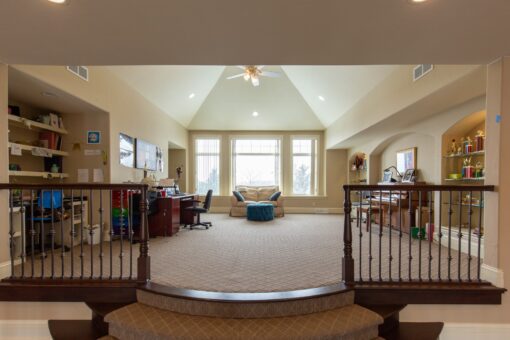 Summerhill loft with vaulted ceiling and railing