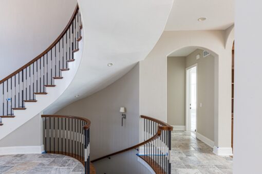 Birchwood curved staircase with wood railing