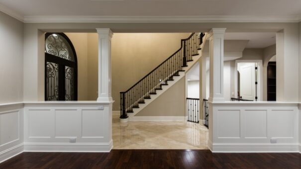 Bella Haven dining room with columns and view to the staircase