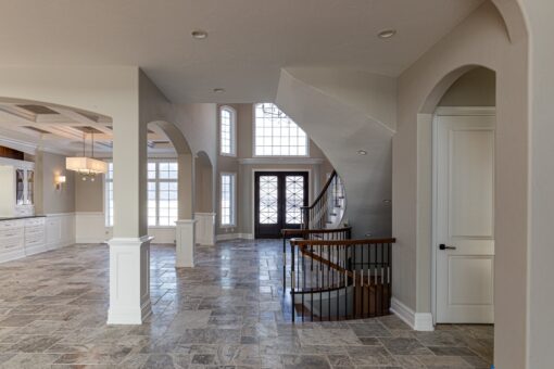 Birchwood dining room open to the foyer staircase