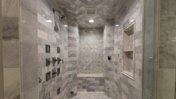 Bella Haven marble walk-in shower with body sprays and bench