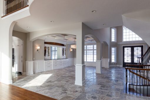 Birchwood dining room with columns and arched opening