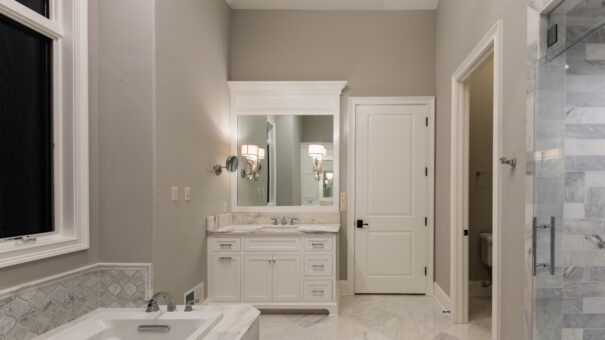 Bella Haven bathroom with white vanity and tub