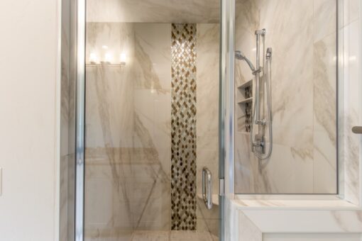 Shire shower with mosaic stripe and marble-look tile