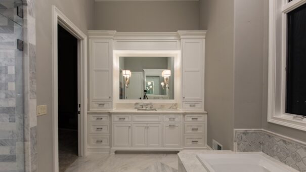 Bella Haven primary bath white vanity with tall cabinetry