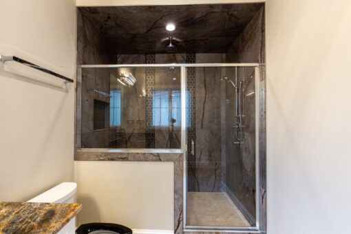Shire dark marble shower with glass enclosure