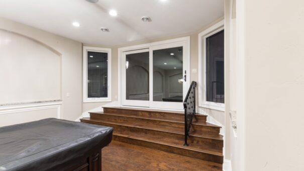 Bella Haven lower-level game room with stepped platform