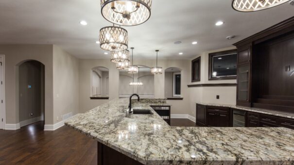 Bella Haven lower-level bar with granite island and chandelier