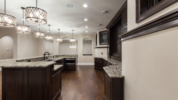 Bella Haven lower-level kitchen with dark cabinetry