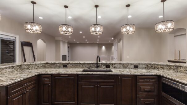 Bella Haven lower-level bar island with granite and pendants