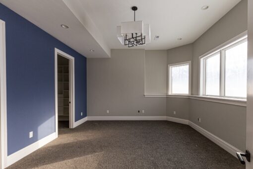 Birchwood bedroom with navy accent wall