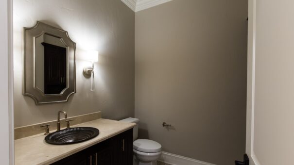 Bella Haven powder room with vessel sink and dark vanity