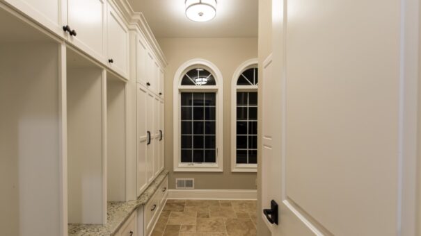 Bella Haven laundry room with arched windows and lockers