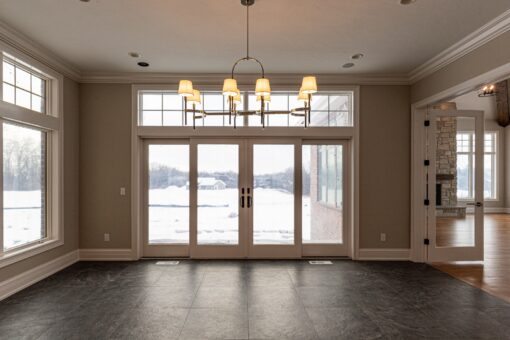 Birchwood breakfast area with French doors and chandelier