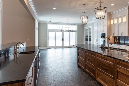 Birchwood kitchen with long wood island and French doors