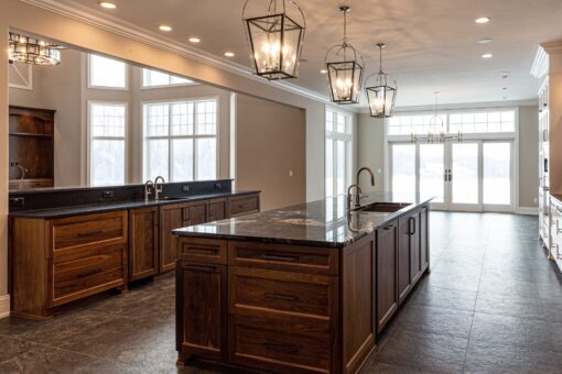 Birchwood kitchen island with dark wood cabinetry