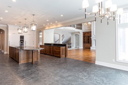 Birchwood kitchen with dark wood island and pendant lights