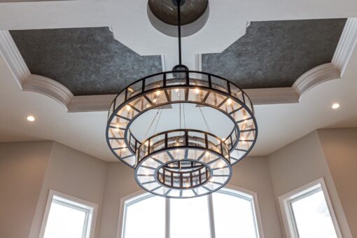 Birchwood tiered ring chandelier beneath a tray ceiling