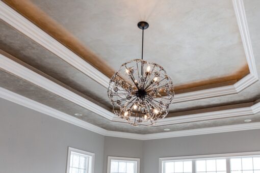Birchwood tray ceiling with sphere chandelier