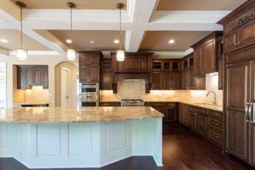 Rivendell kitchen with white island and dark range wall