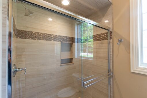Rivendell glass shower with mosaic band