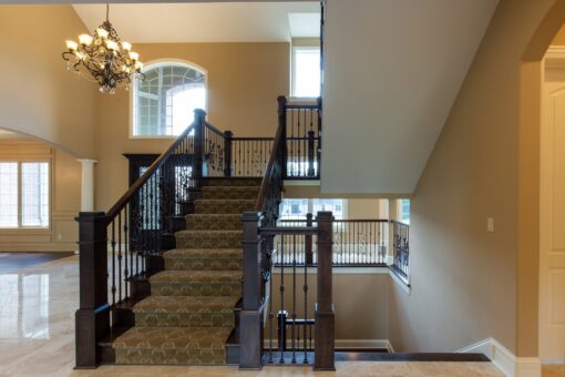 Rivendell staircase with carpet runner and iron railing