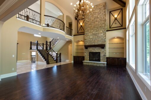 Rivendell great room with stone fireplace and staircase