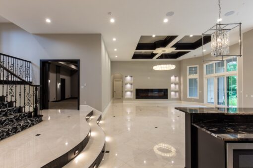 Shire lower level with coffered ceiling and linear fireplace