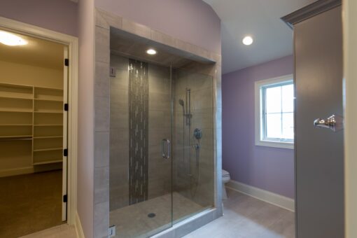 Grand Haven glass shower with mosaic stripe