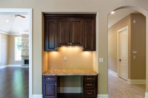 Rivendell kitchen desk with dark cabinetry