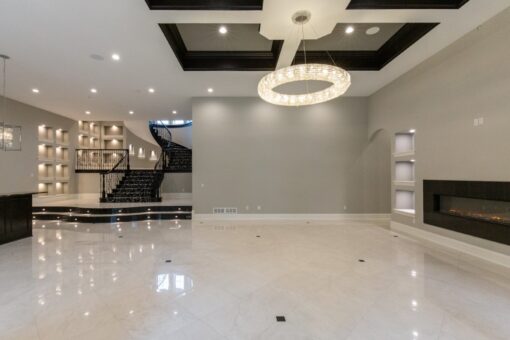 Shire lower level with ring chandelier and spiral staircase