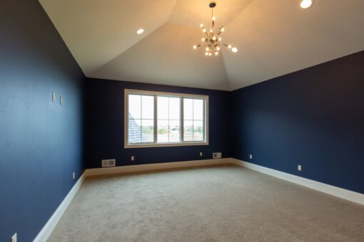 Grand Haven bedroom with navy accent walls