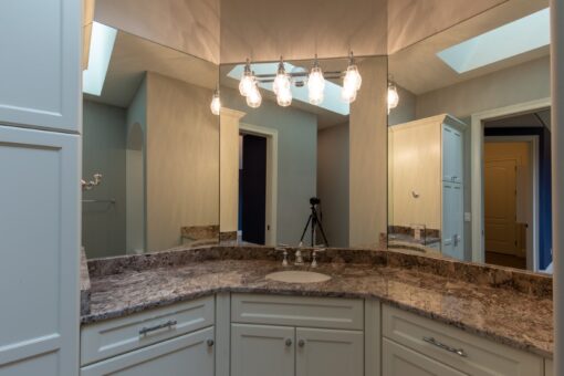 Grand Haven primary bath vanity with granite counters