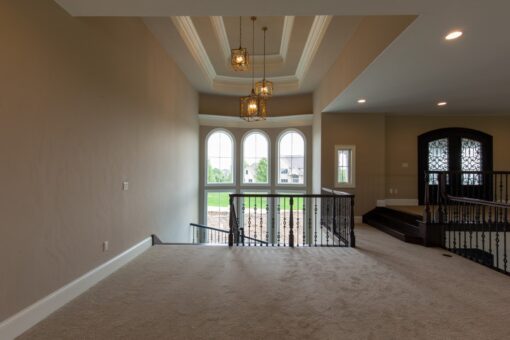 Grand Haven loft overlooking the foyer chandelier