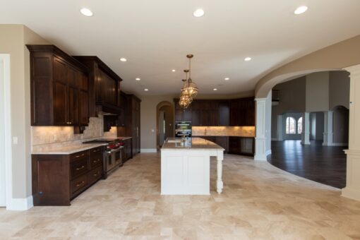 Grand Haven kitchen with dark wood cabinetry and pendant lights