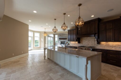 Grand Haven kitchen with white island and dark perimeter cabinetry