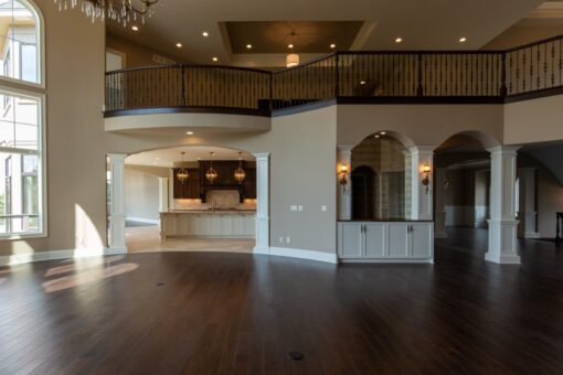Grand Haven great room with balcony above and view to the kitchen