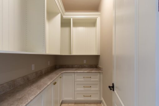 Grand Haven butler's pantry with white cabinetry