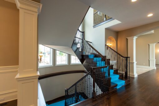 Grand Haven foyer staircase with wrought-iron railing