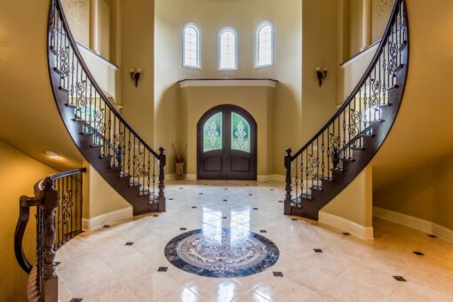 Brandywine foyer with double staircase and marble medallion