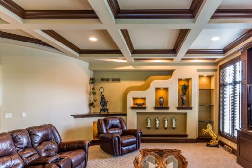 Brandywine hearth room with coffered ceiling and lit niches